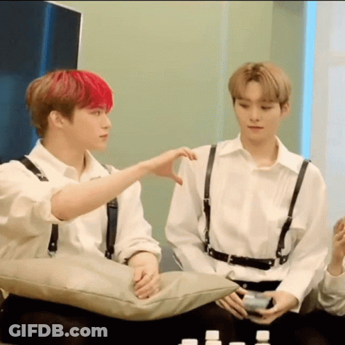 Two Young Men Sitting On Couch One With Red Hair GIF