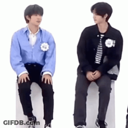 Two Young Men Sitting On White Box GIF