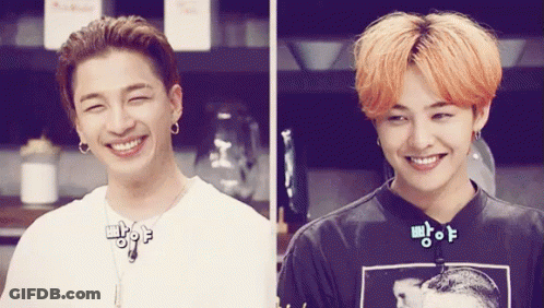 Two Young Men Smiling In Kitchen GIF