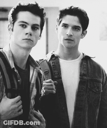 Two Young Men Standing Next To Each Other One With Backpack GIF