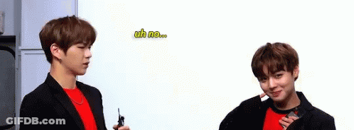 Two Young Men Standing Together GIF
