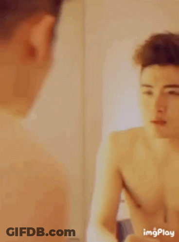 Two Young Men Talking In A Room GIF