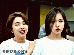 Two Young Women Looking At Each Other GIF