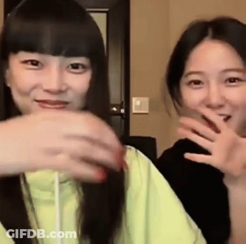 Two Young Women Making Funny Faces GIF