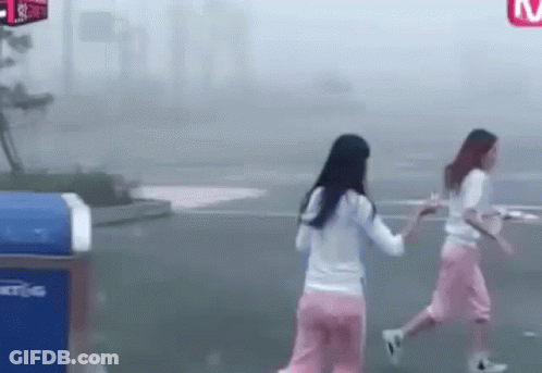 Two Young Women Walking In Fog GIF