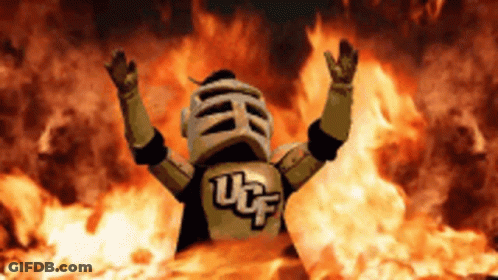 UCF Knight Mascot In Front Of Fire GIF