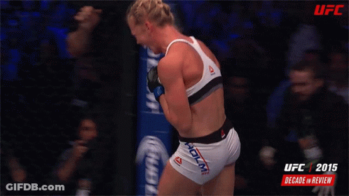 UFC 2015 Decade Review Poster Woman In Reebok Top GIF