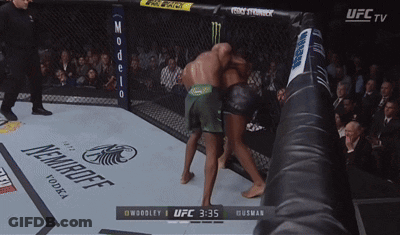 Ufc Tv Shows A Boxing Match Between Woodley And Husman At 3:35 GIF