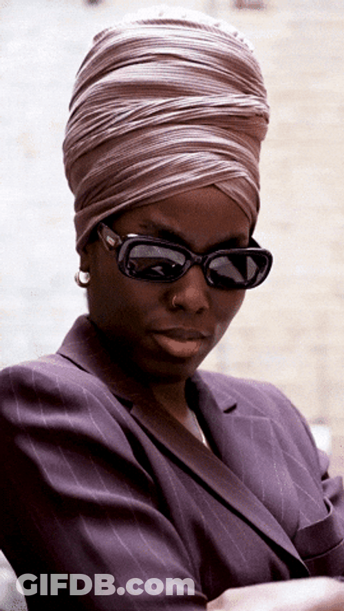Unbothered Girl Holds Shades What GIF