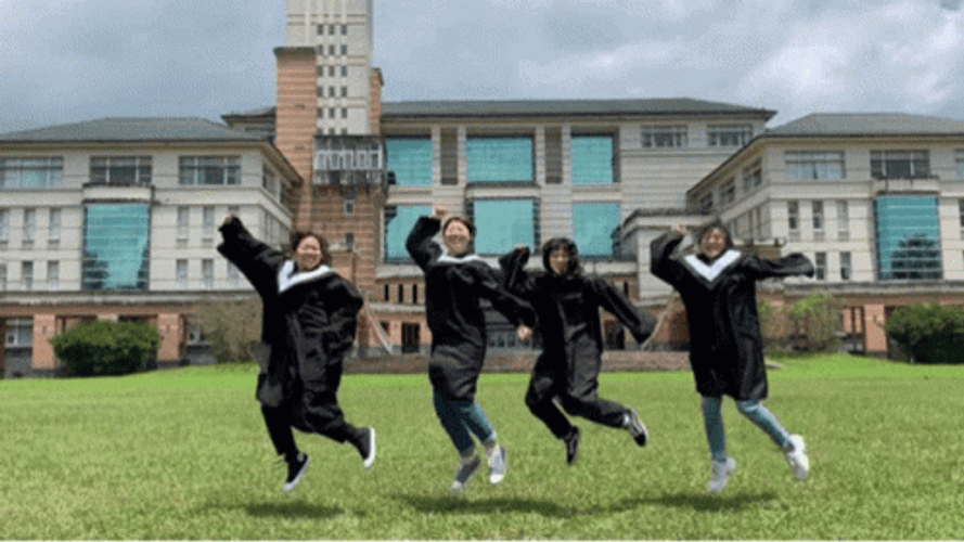 University Graduation Girls Jump Shot GIF