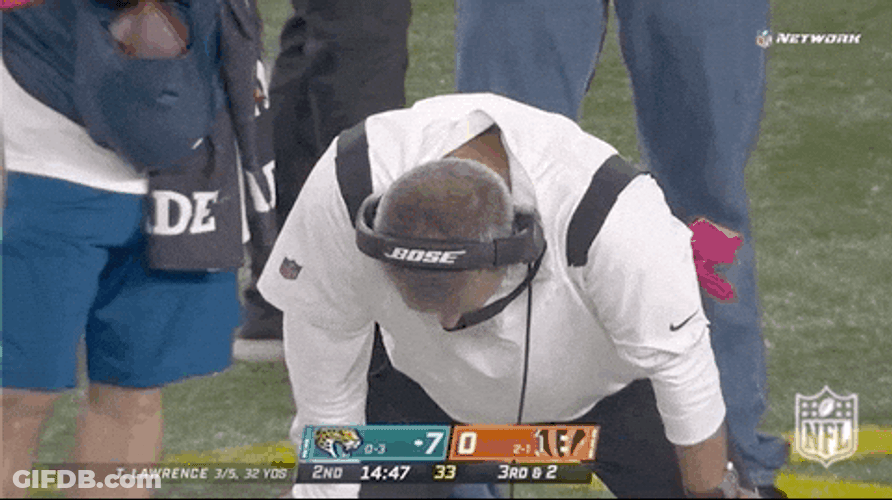Urban Meyer Head Down With Determined Look GIF