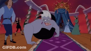 Ursula From The Little Mermaid Is Sitting On A Purple Carpet In Front Of A Crowd Of People . GIF