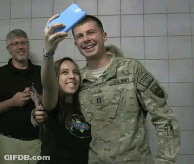 US Navy Man Taking Selfie With Woman GIF
