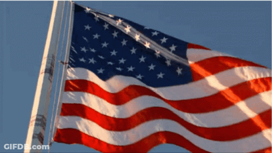 Usa Flag Waving Against Blue Sky GIF