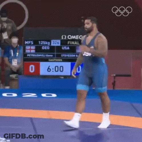USA Wrestler Standing On Mat In Front Of Scoreboard GIF