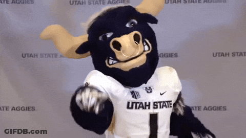 Utah State Aggies Mascot In Front Of Wall GIF