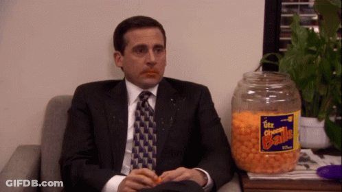 Utz Cheese Balls Jar Next To Man In Suit GIF