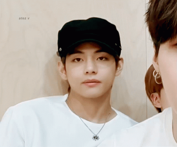 V Is Forced To Smile At The Camera GIF
