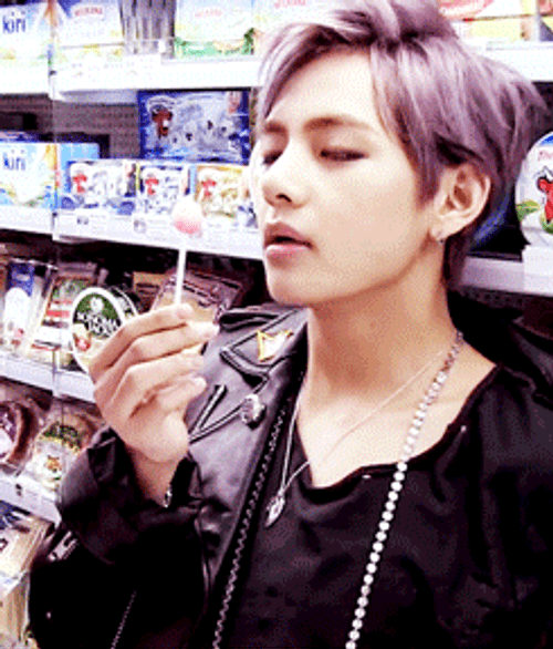 V Licking His Lollipop Slowly GIF