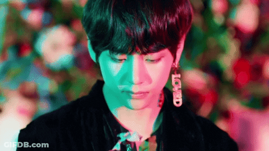V Smelling A Flower GIF
