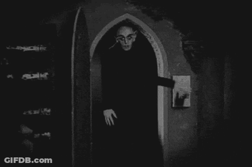 Vampire Standing In Archway GIF