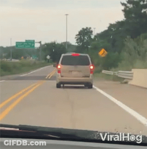 Van Driving Down Highway Next To I'm Sorry Sign GIF