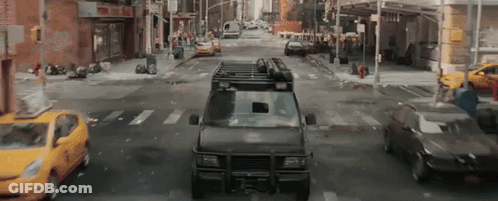 Van With Roof Rack Driving City Street GIF