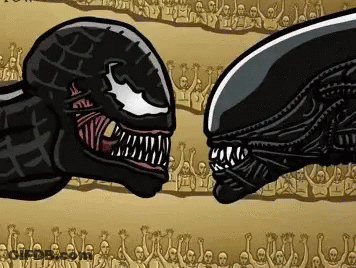 Venom And Alien Facing Each Other In Front Of Crowd GIF
