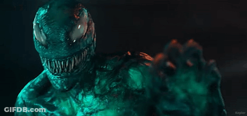 Venom Character Close Up Dark Room Green Background GIF