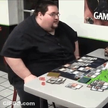 Very Fat Man At Table With Cards And Dice GIF
