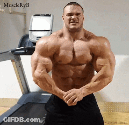Very Muscular Man Standing In Front Of Treadmill GIF