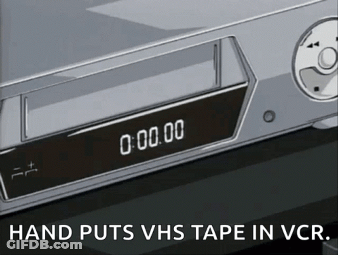 Vhs Tape Putting In VCR Player GIF