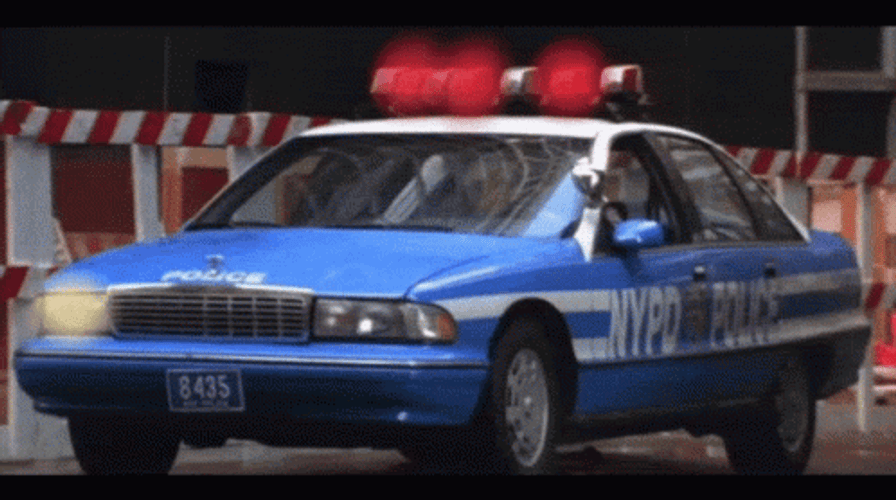 Vibrant Blue Police Car Open Lights GIF