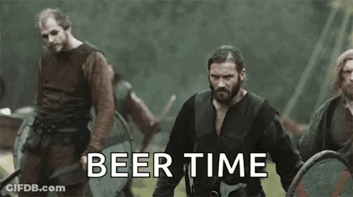 Vikings Standing In Field With Shields And Swords GIF