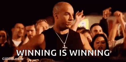 Vin Diesel Is Standing In Front Of A Crowd Of People And Saying Winning Is Winning . GIF