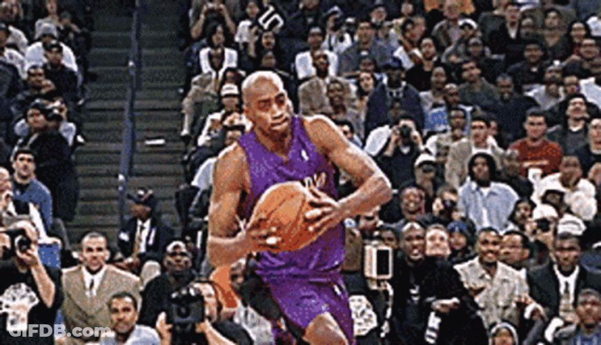 Vince Carter Twists Dunks GIF