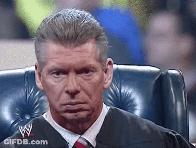 Vince Mcmahon Looking On The Side GIF