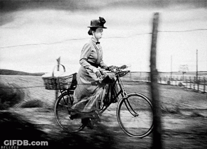 Vintage Bike Riding Lady Almira Gulch GIF