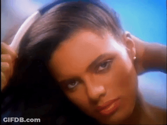 Vintage Combing Black Hair Advertisement GIF