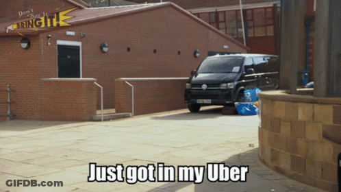 Volkswagen Van In Front Of Brick Building GIF