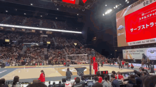 Volleyball Game In Front Of Screen Saying All The Stars All The Fans GIF