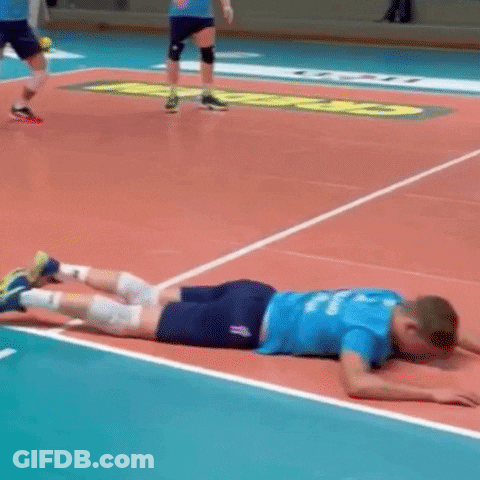 Volleyball Player Lying On Court With Legs Crossed GIF