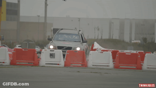 Volvo Car With Del Arte Driving Down Road GIF