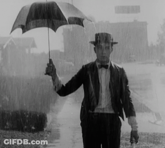 Walking Keaton In Rain GIF