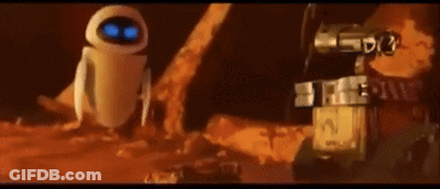 Wall E And Eve From The Movie Wall E Are Standing Next To Each Other In The Dirt GIF
