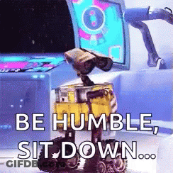 Wall E Says Be Humble Sit Down In Front Of Computer Monitor GIF