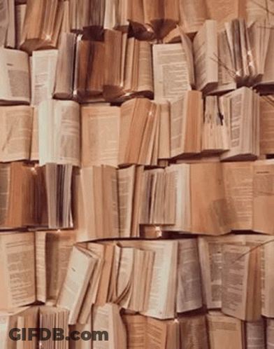 Wall Of Books Stacked On Table GIF