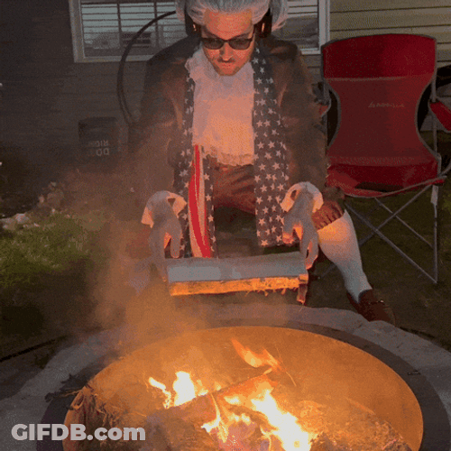 Warming Up With Firewood Outside GIF