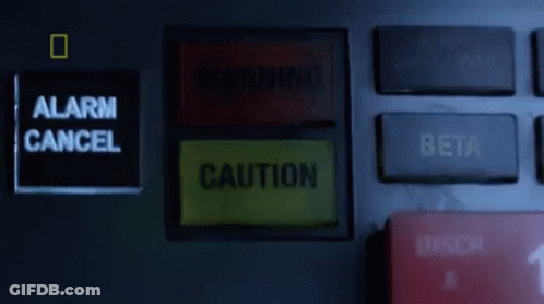 Warning Sign Next To Alarm Cancel Button GIF