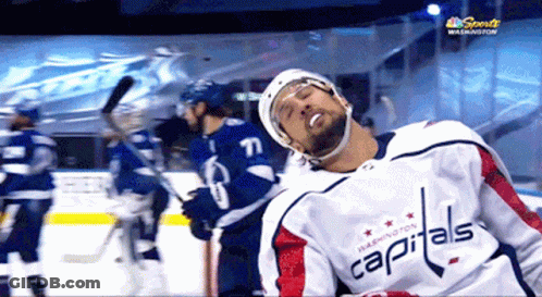 Washington Capitals Hockey Player Laying On Ice GIF